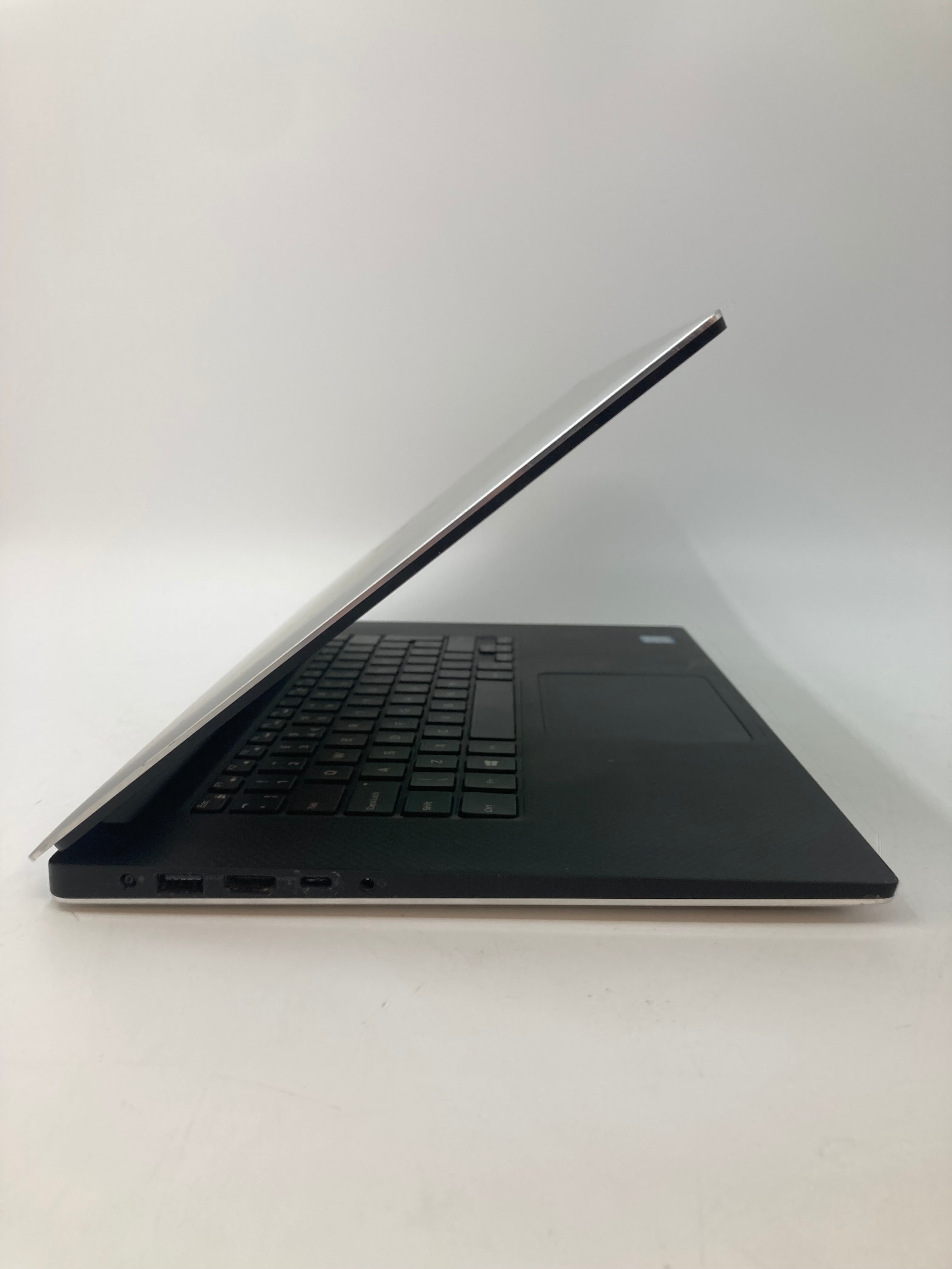 Dell XPS 15 7590 side view showing USB, USB-C HDMI, and AUX ports
