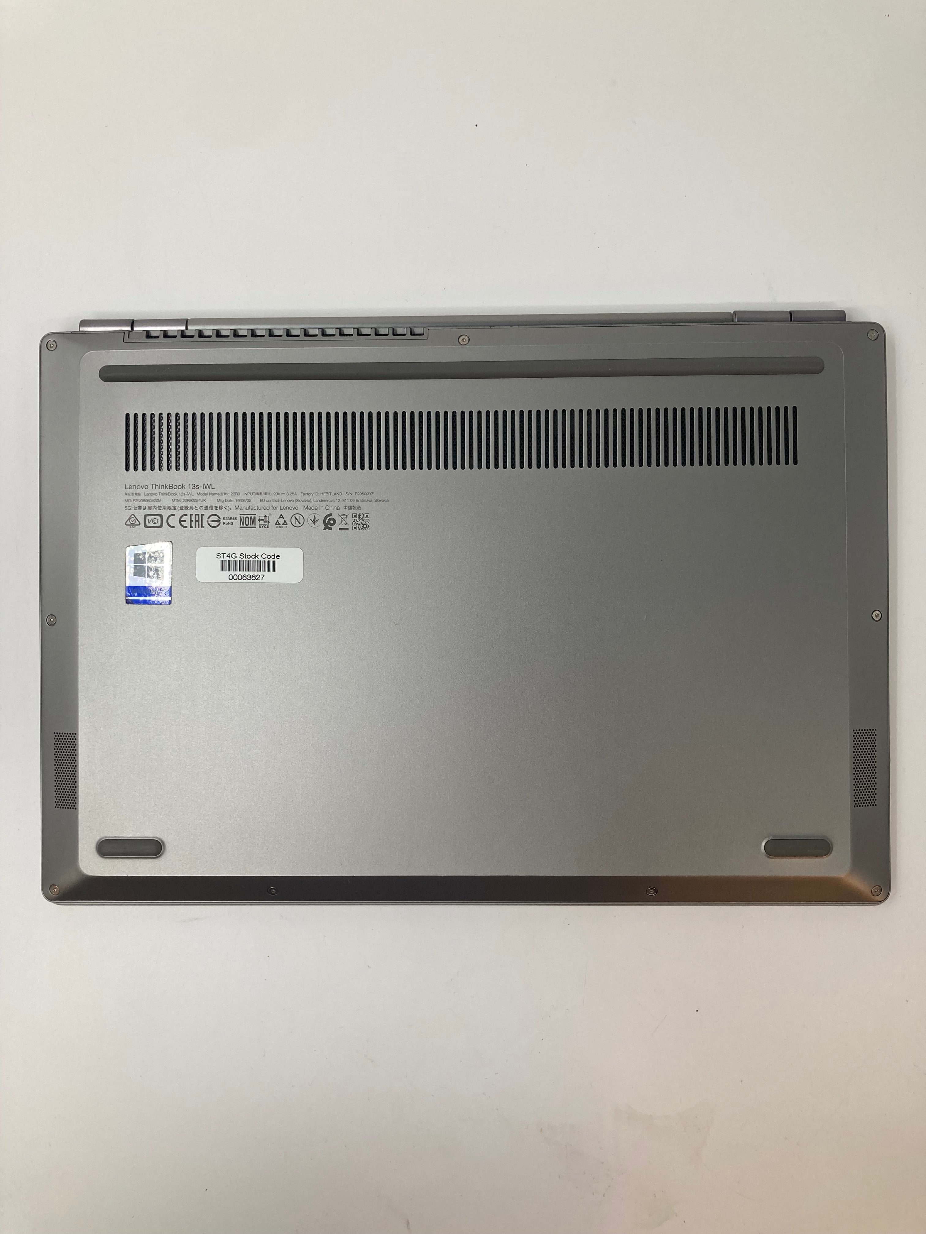 Lenovo ThinkBook 13S-IWL bottom view showing vents and serial tags