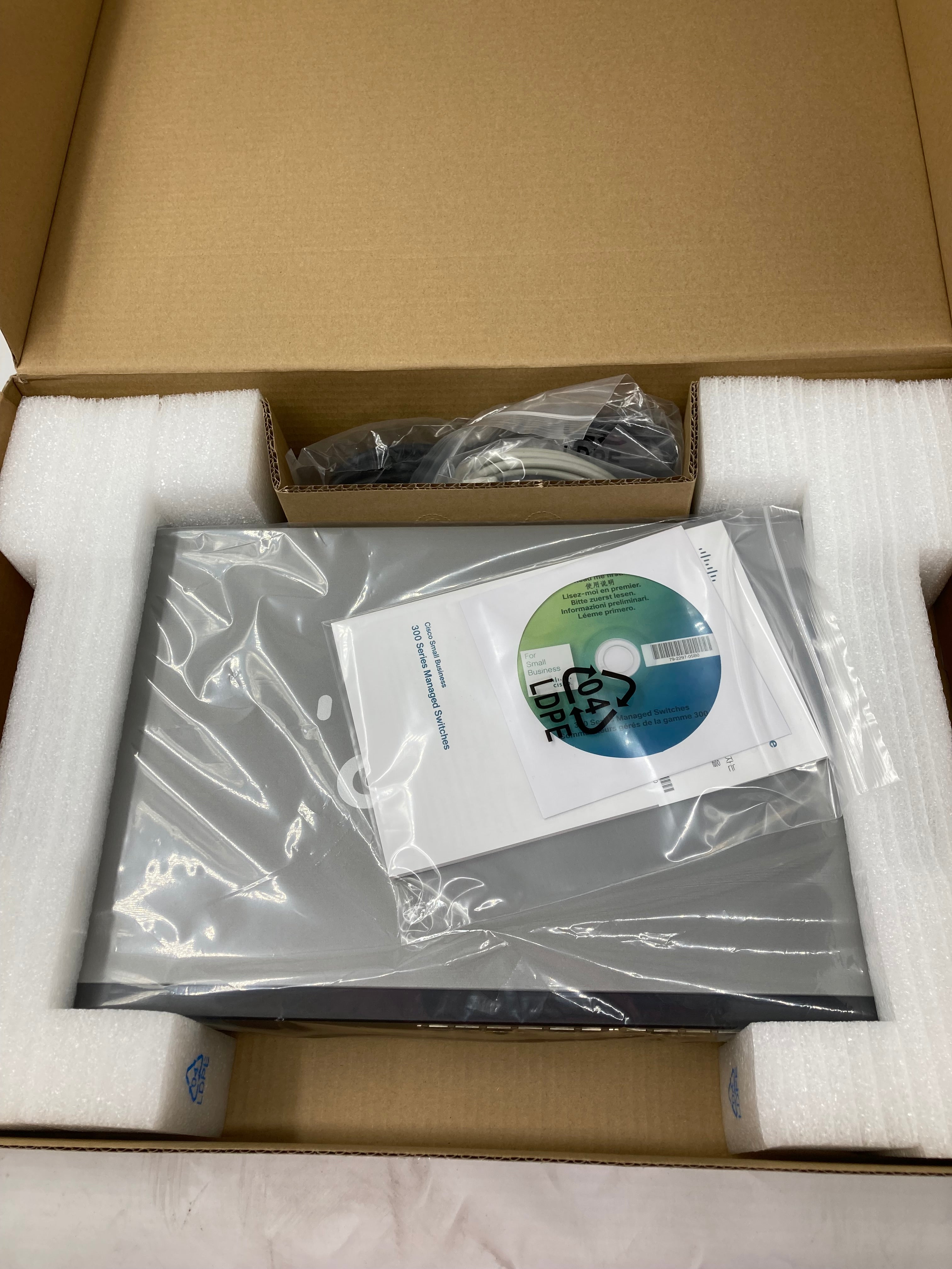 Cisco SF300-24 24 Port 10/100 Managed Network Ethernet Switch - Black Silver