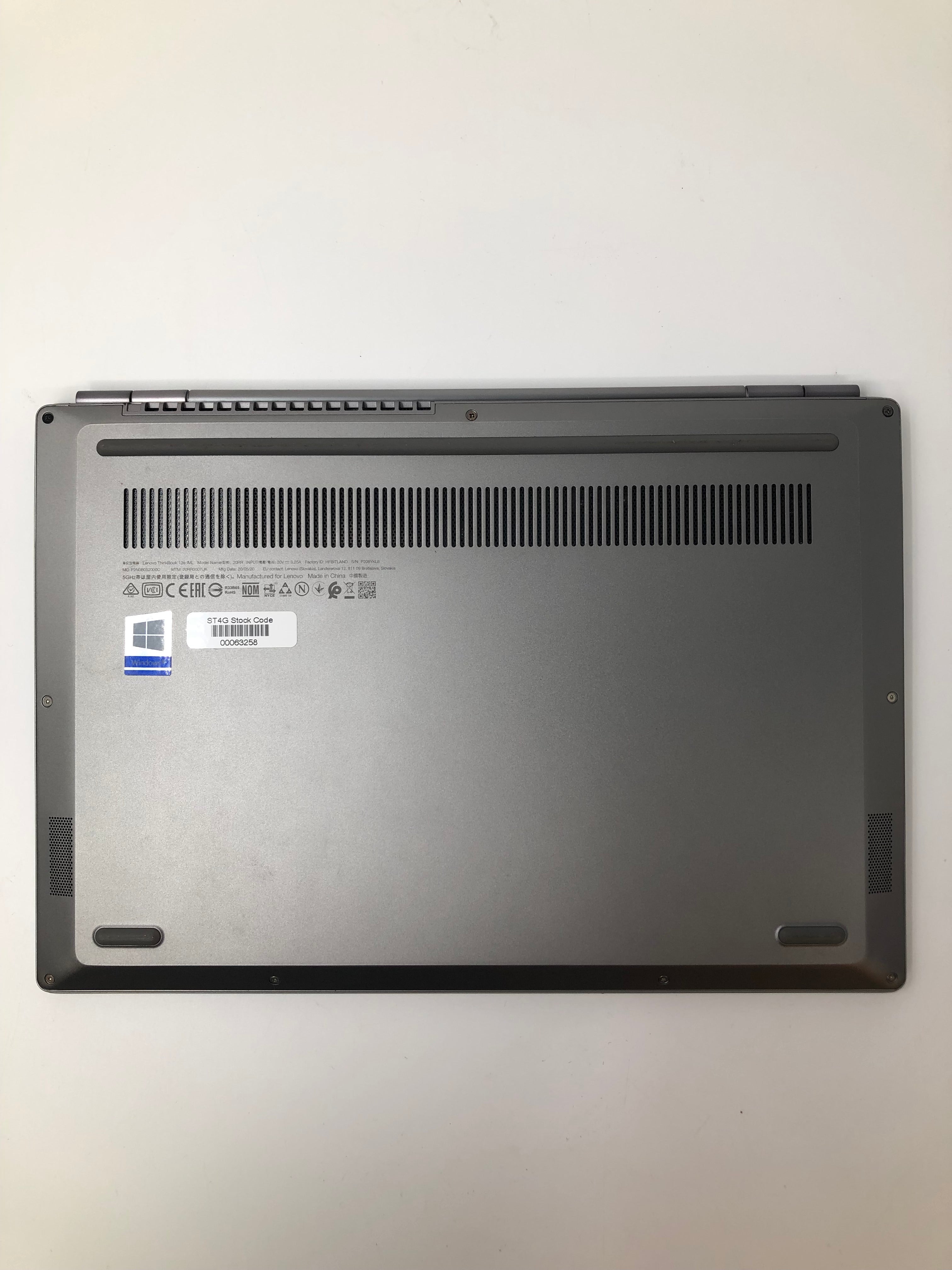 Lenovo ThinkBook 13S-IML bottom view showing vents and serial tags