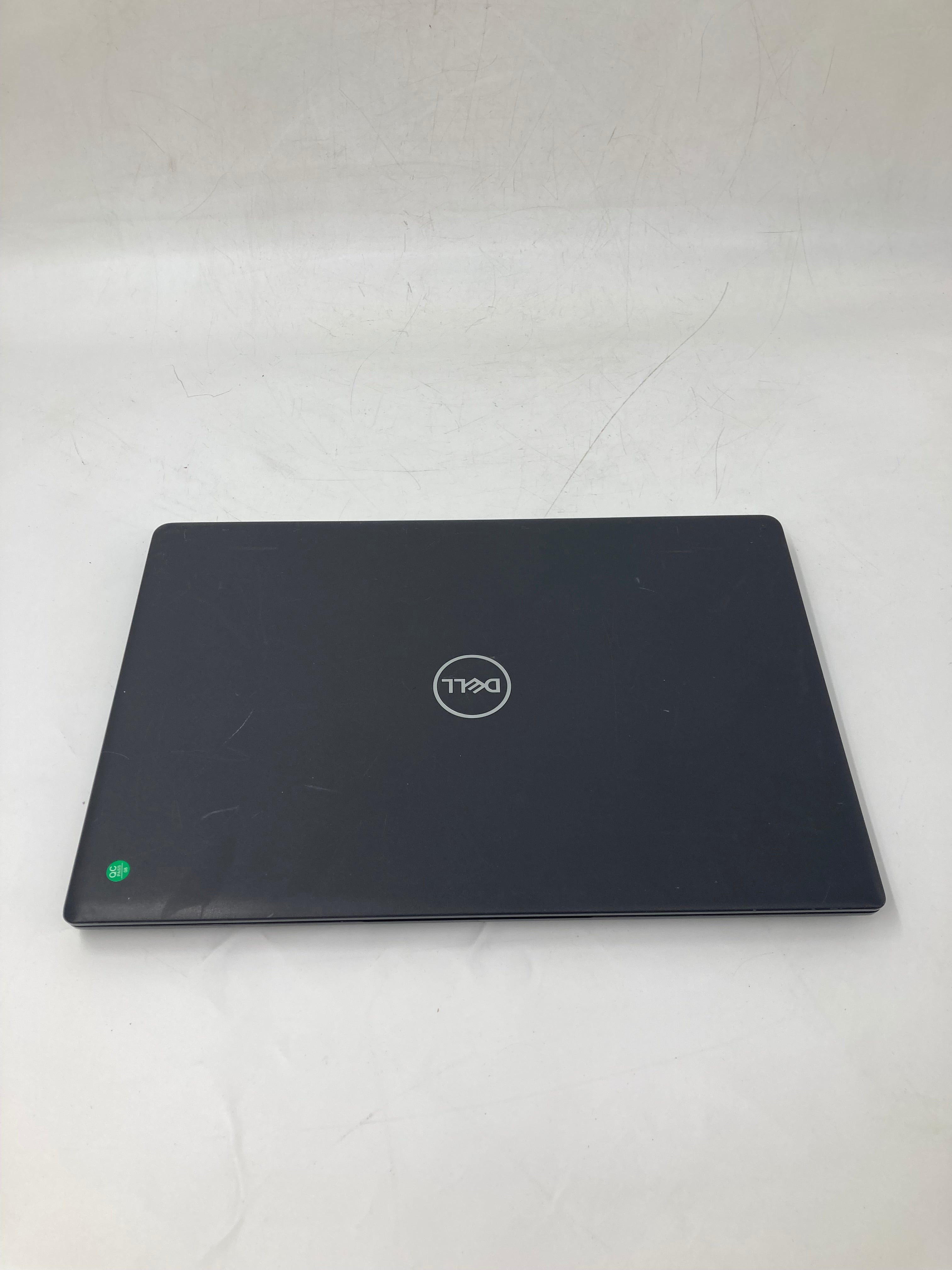 dell latitude 3510 lid showing dell logo and some minor scratches
