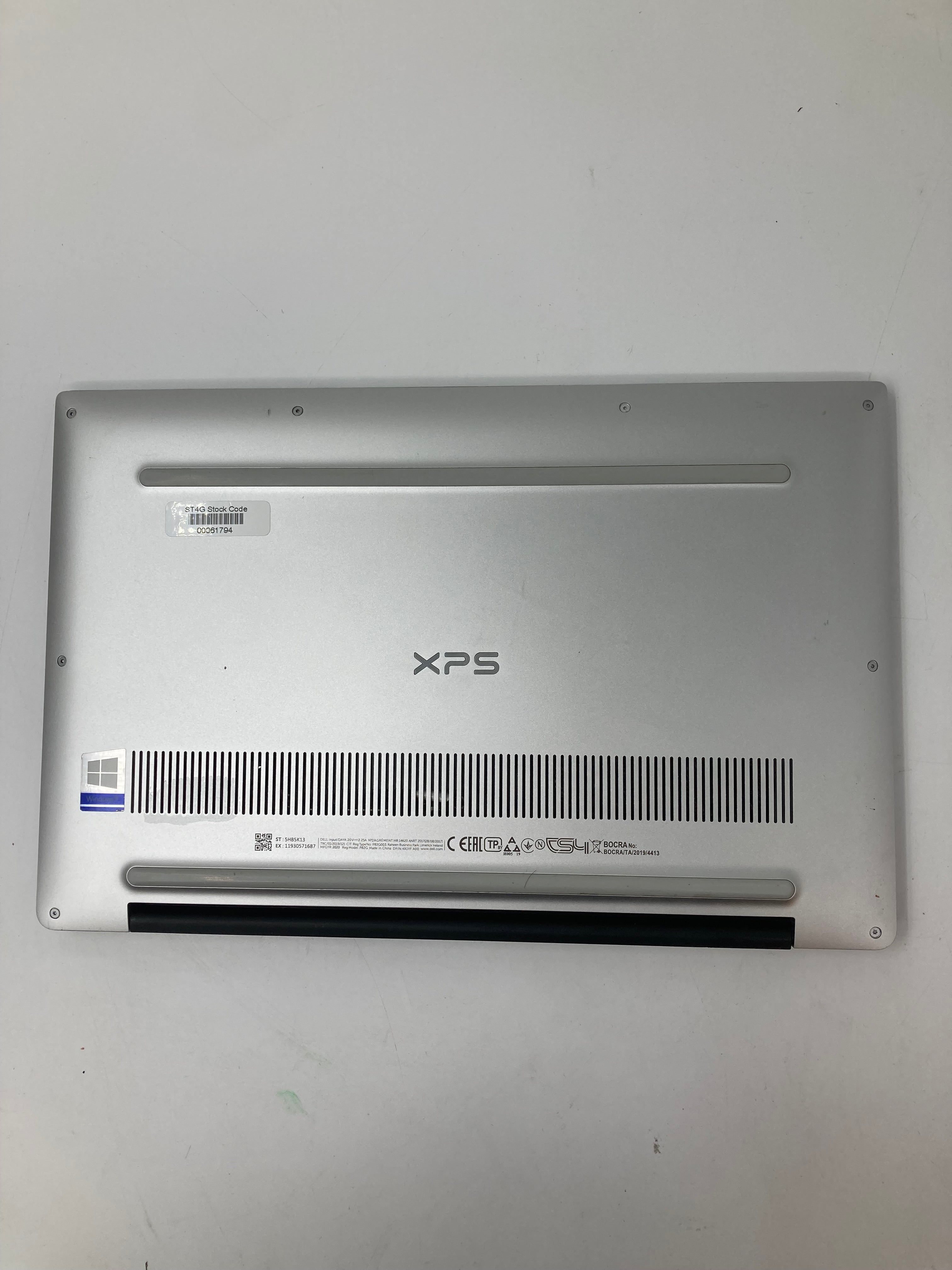 Dell XPS 13 7390 bottom view showing serial tags and vents