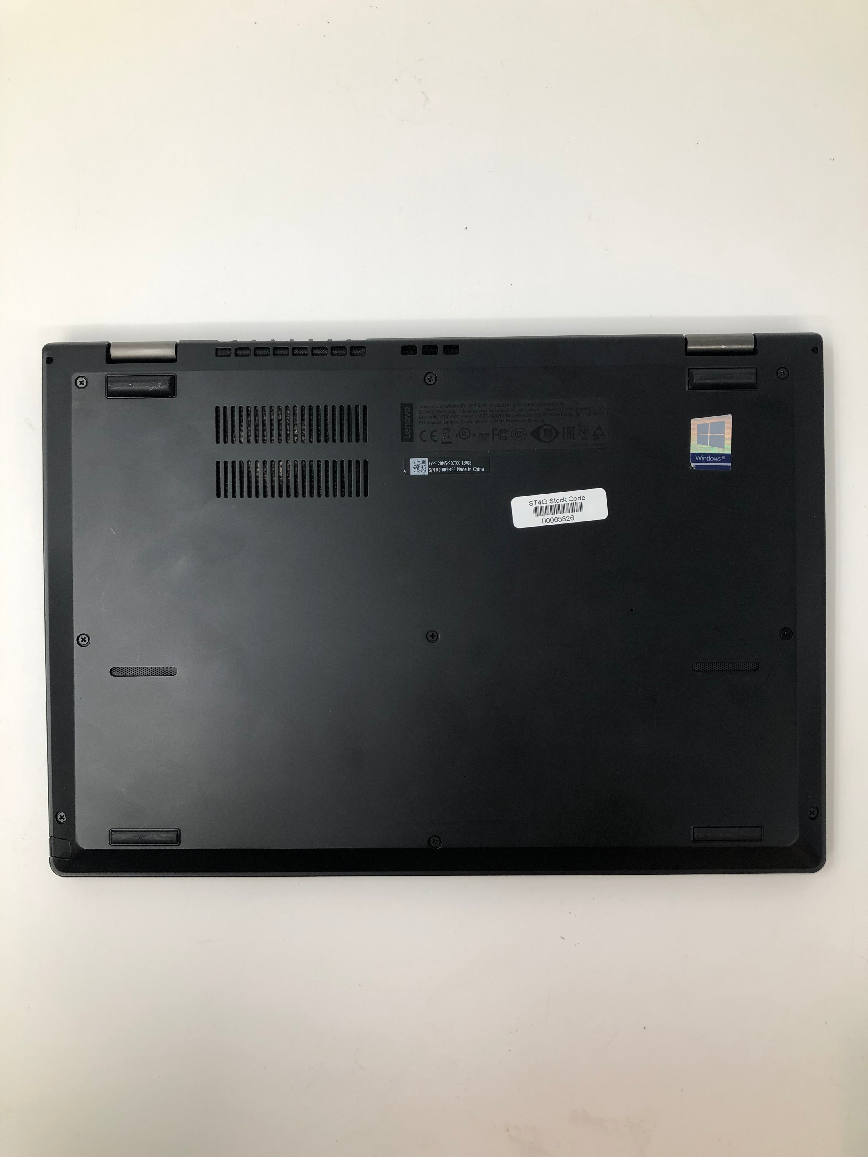 Lenovo ThinkPad L380 bottom view showing vents and serial tags