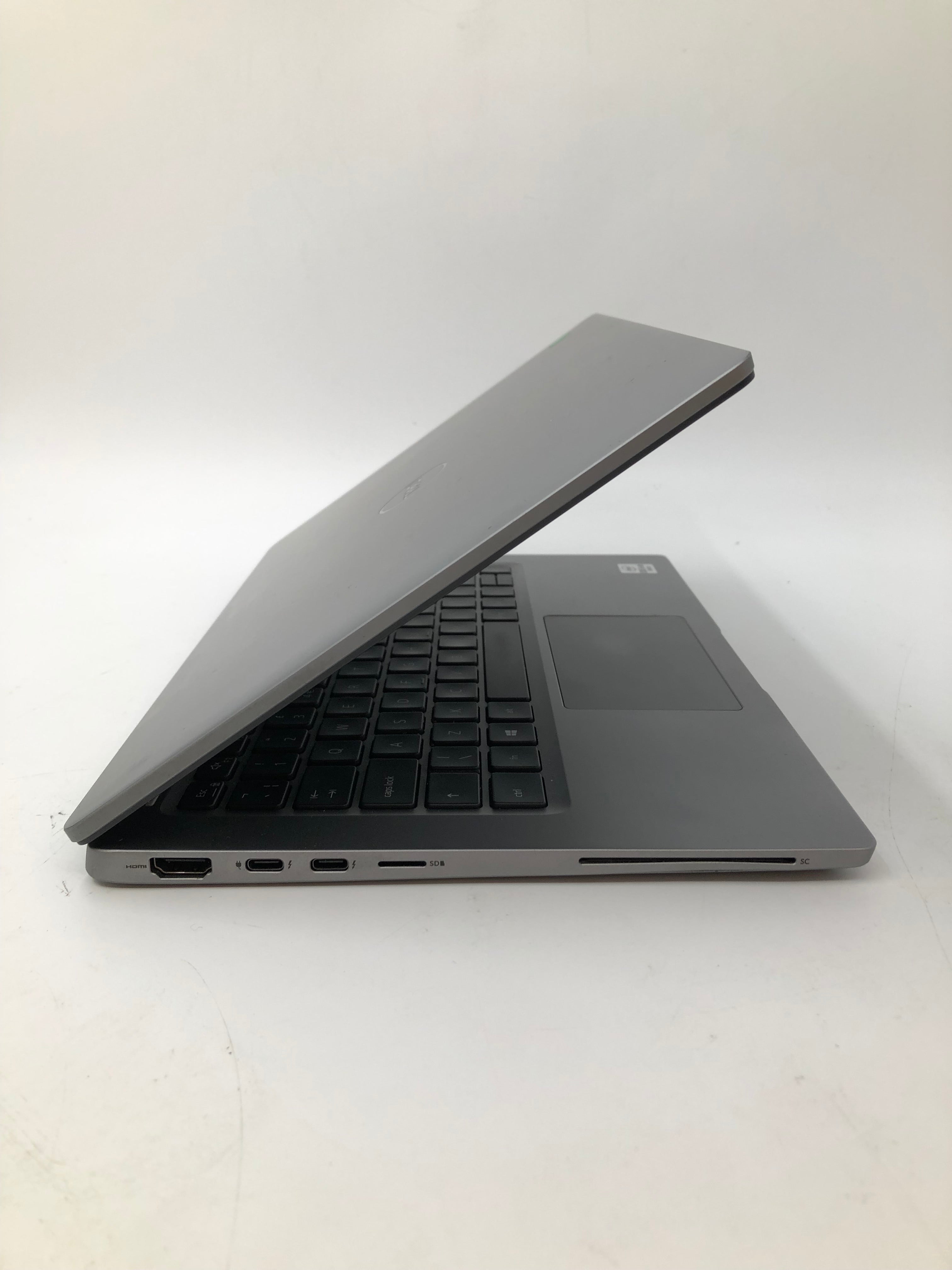 Dell Latitude 7310 side view showing charging, HDMI and SC ports