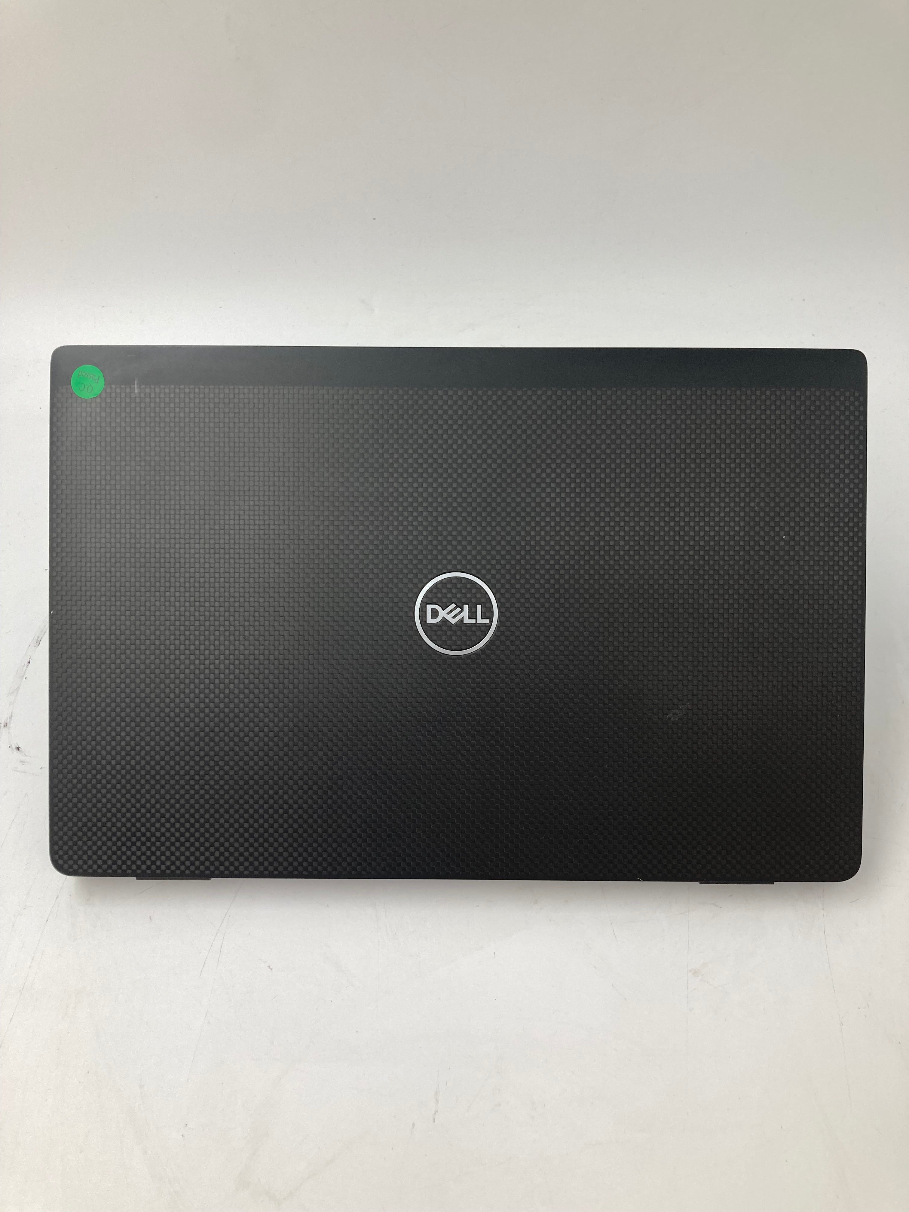 Dell Latitude 7320 top view showing logo and small scratch