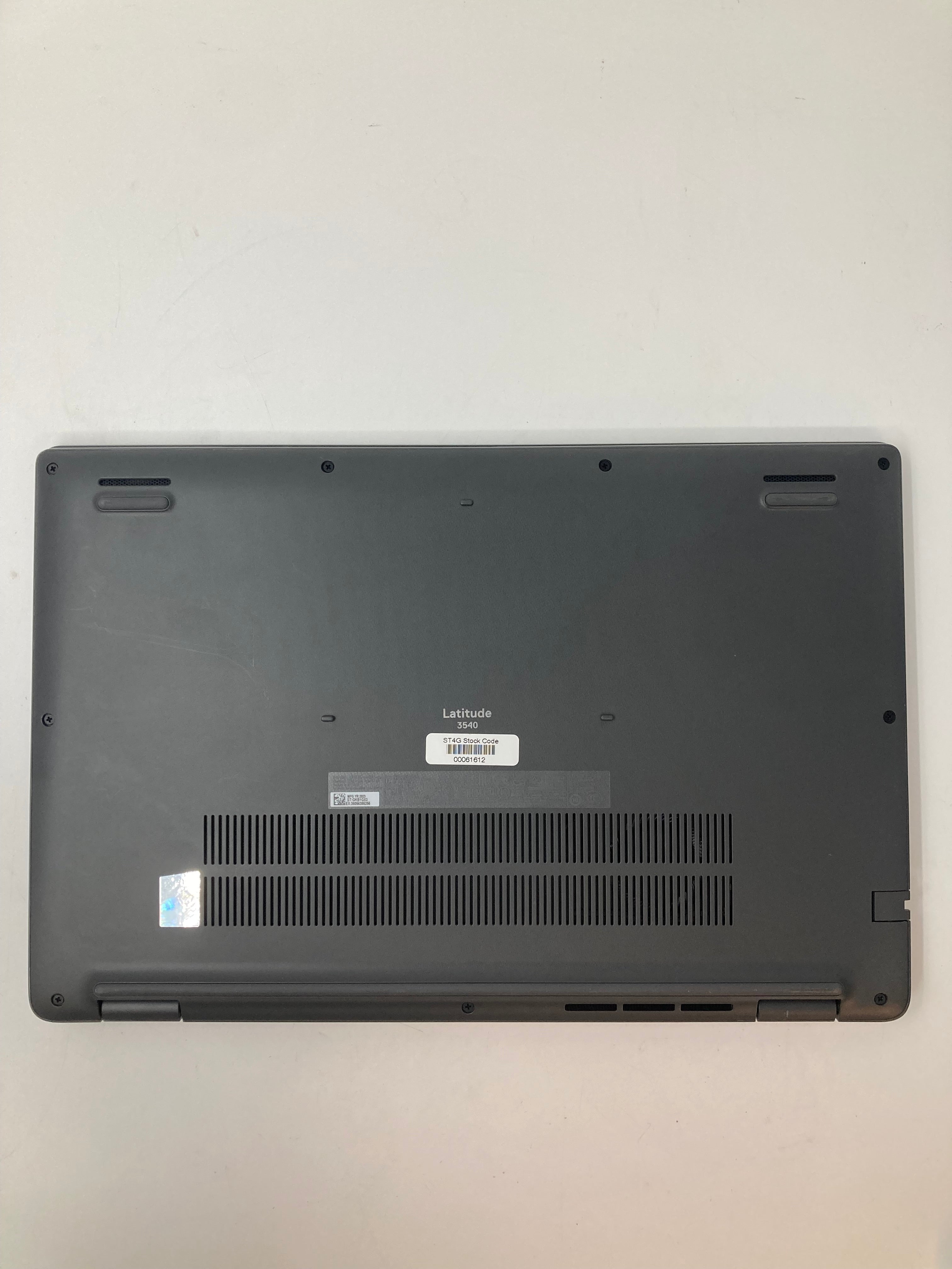 Dell Latitude 3540bottom view showing vents and serial tags